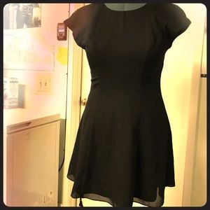Beautiful flowy little black dress with bow back